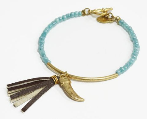 Beaded bracelet with leather tassel and claw charm